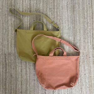 Pair of Baggu Duck Bag totes with zipper pocket and snaps